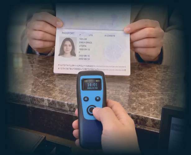Verify the document and the person presenting it A hotel receptionist aiming a compact Marson handheld scanner at a passport data page.