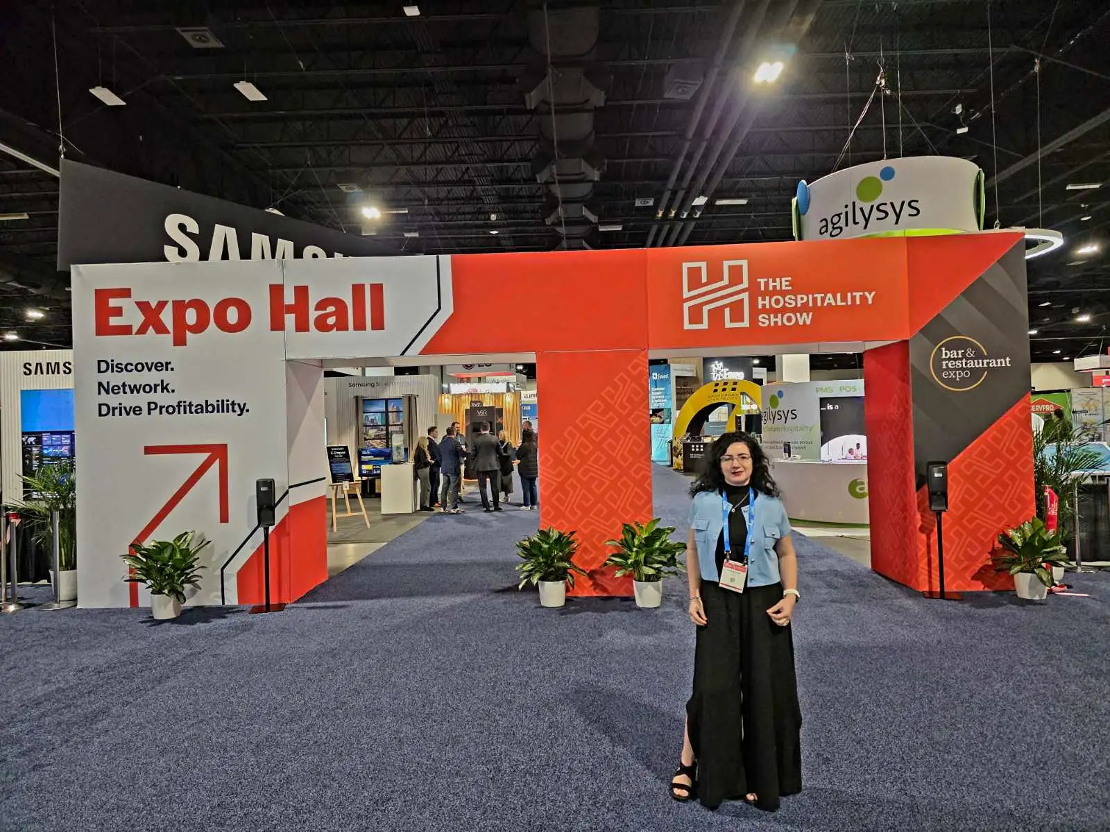 V5iD CEO at Expo Hall Entrance: Welcoming Innovation at The Hospitality Show 2025 in Denver, CO V5iD CEO standing at the Expo Hall entrance of The Hospitality Show 2025.