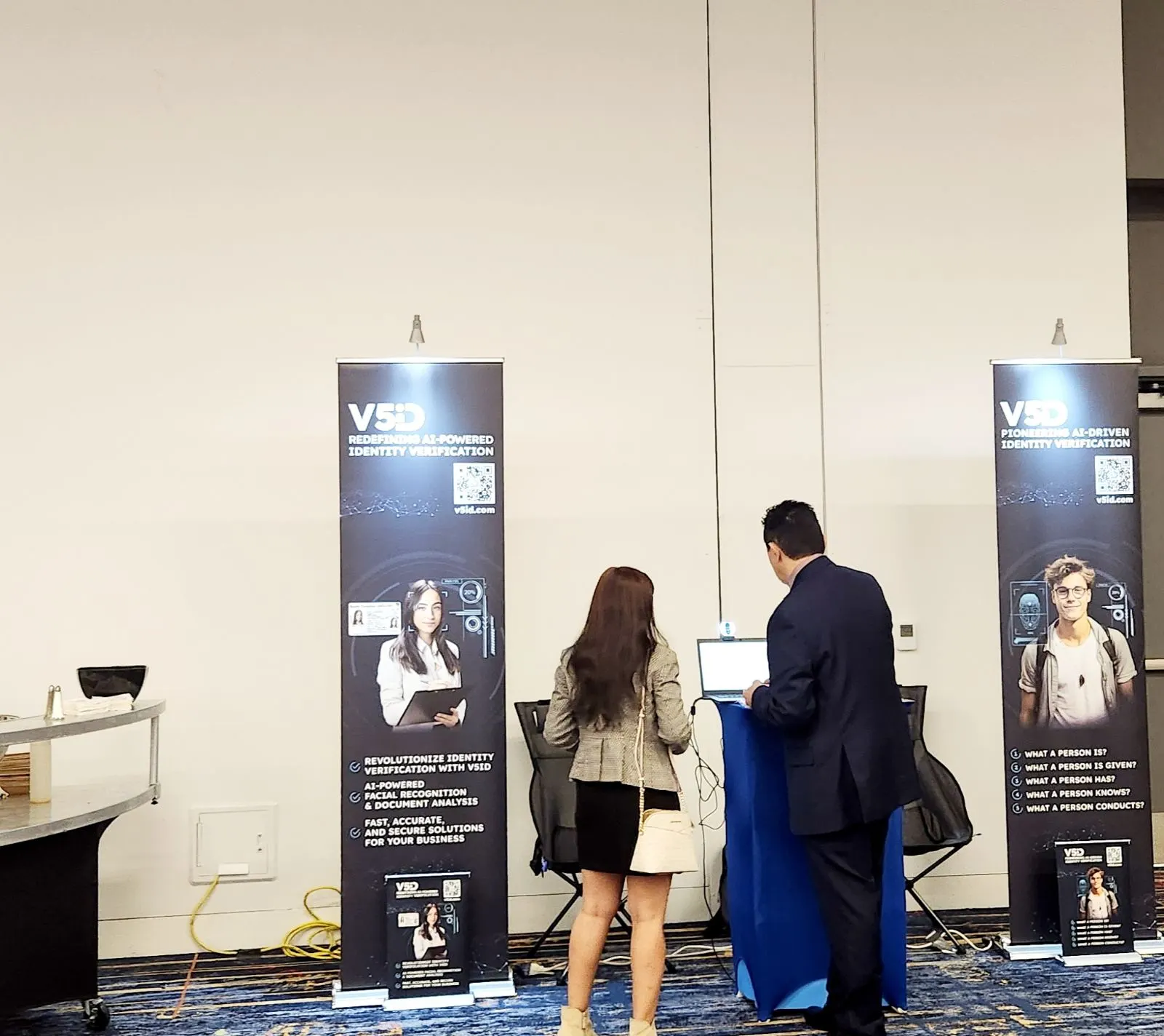 Attendees learning about V5iD Identity Verification Kiosk at the booth