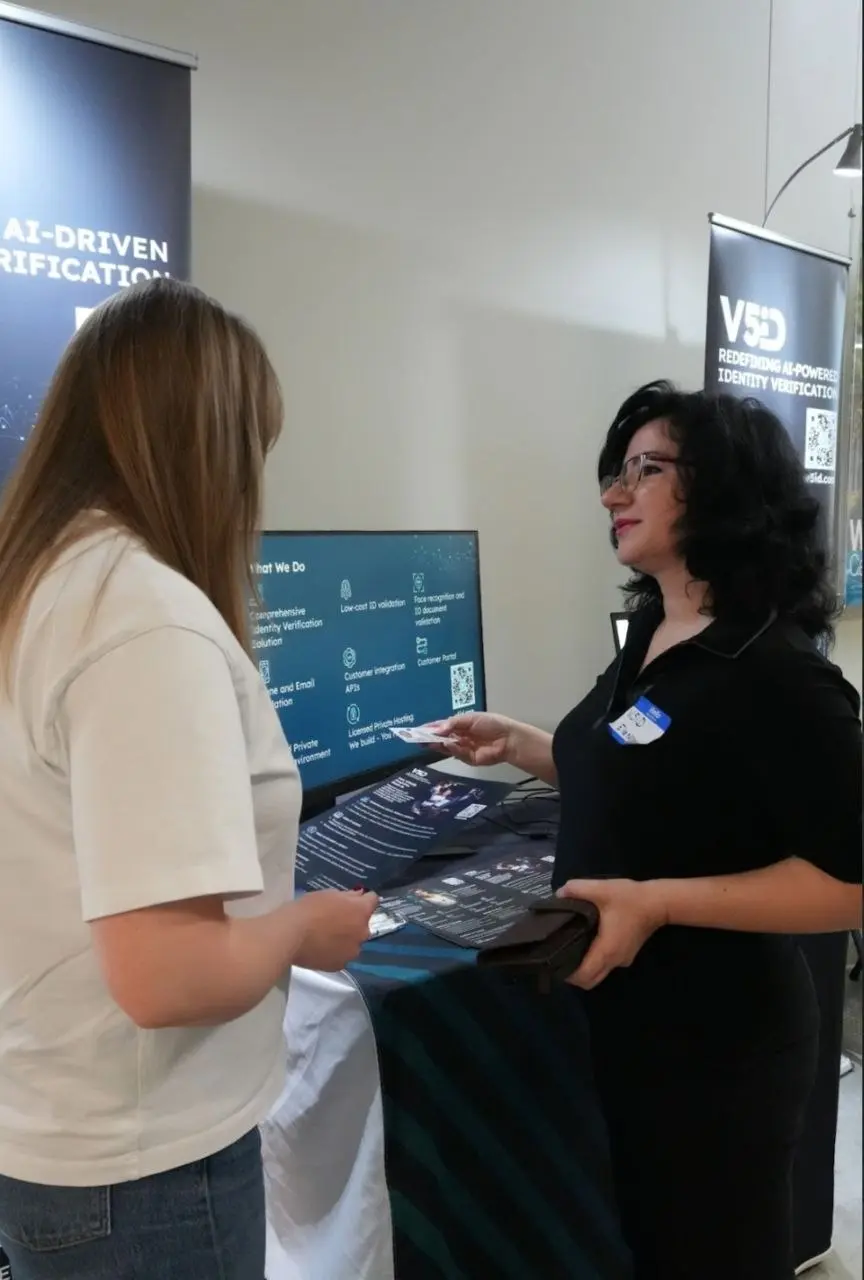 Identity Verification Platform Demo at V5iD® Booth V5iD® CEO presenting identity verification platform demo to booth visitor