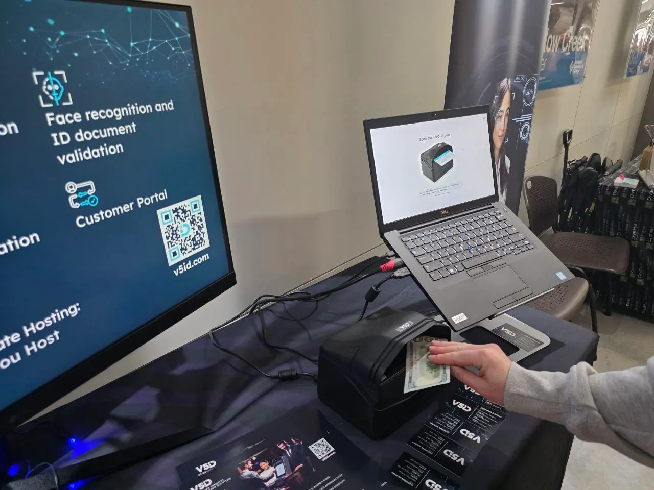 Currency Validation Demo at V5iD® Booth Attendee using V5iD® kiosk for currency validation and identity verification