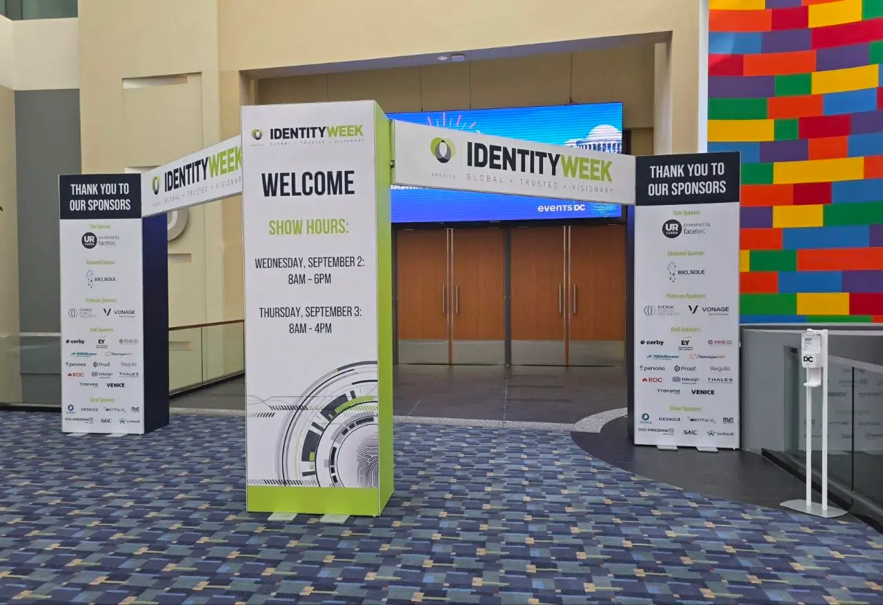 Identity Week America 2026 welcome archway displaying show hours and thank-you banners for sponsors at the convention center entrance