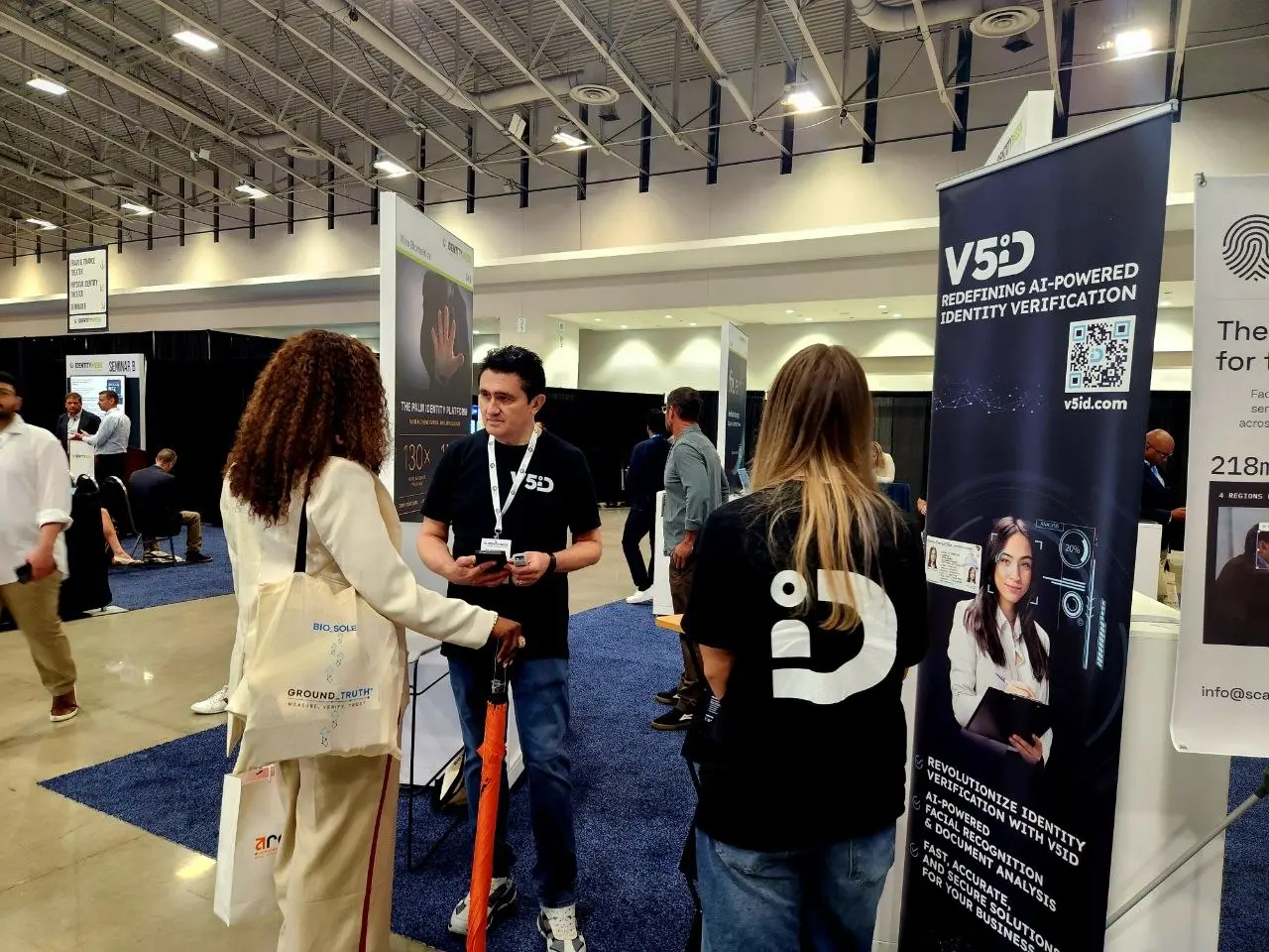 V5iD representative engaging with visitors at the AI-powered identity verification booth during Identity Week America 2026 exhibition
