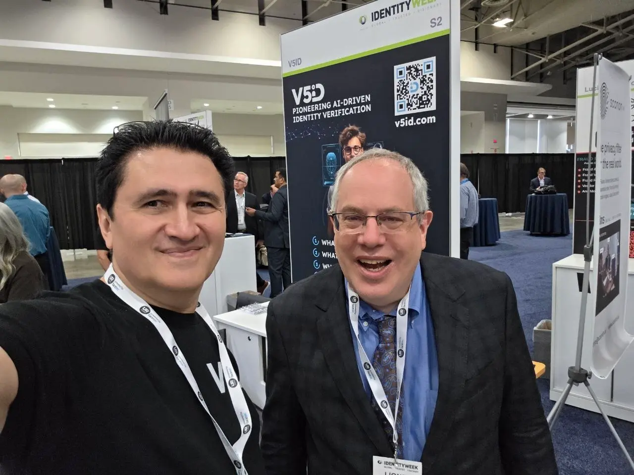 Selfie of V5iD representative with an industry professional in front of the V5iD pioneering AI-driven identity verification booth at Identity Week America 2026