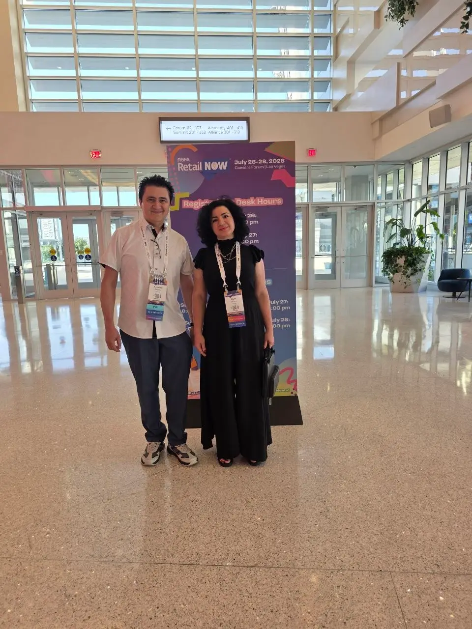 V5iD CEO and CTO at RSPA RetailNOW 2026, Caesars Forum Las Vegas V5iD CEO and CTO posing together in front of the official RSPA RetailNOW 2026 registration desk banner inside Caesars Forum, Las Vegas, July 26-28, 2026.